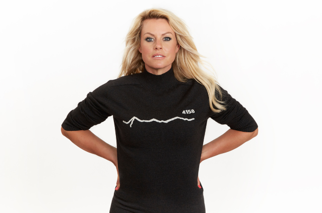 chemmy alcott posing against white background