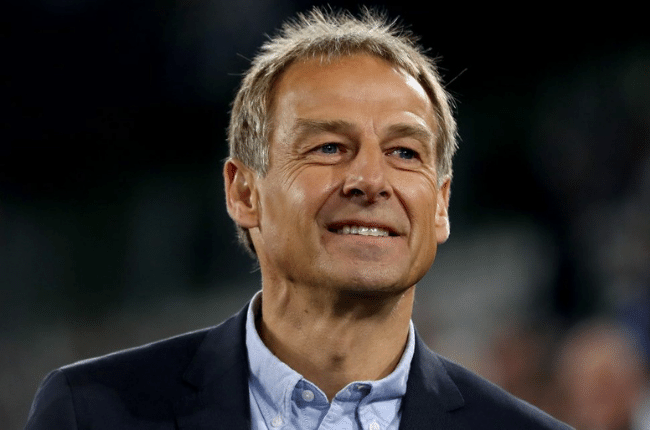 jurgen klinsmann at soccer game smiling