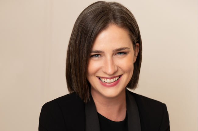 Sara M. Watson smiling at the camera